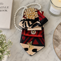Red Black Abstract Print Junk Tie | Gold Crystal Flower Brooch